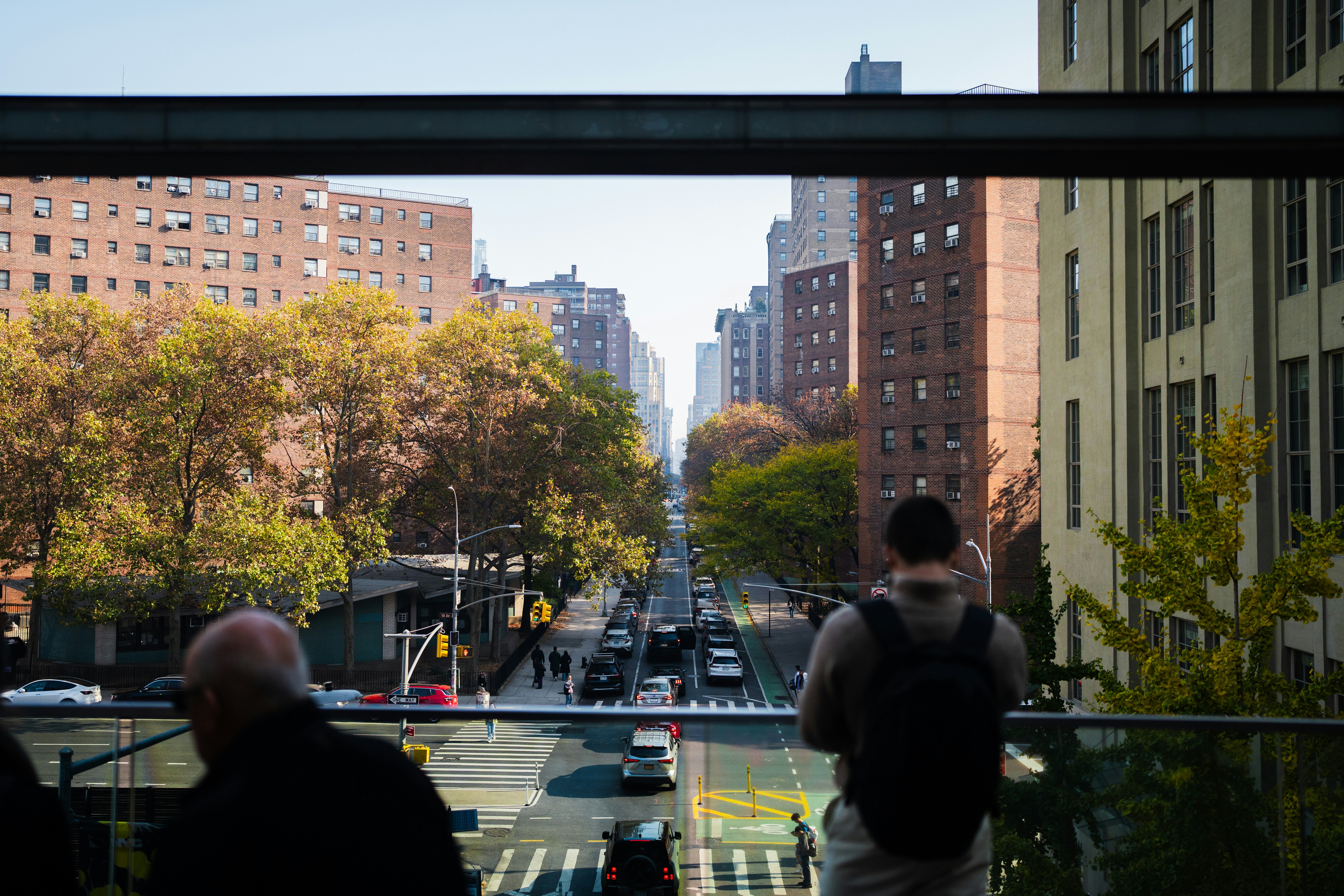 A group of people standing next to each other on a balcony