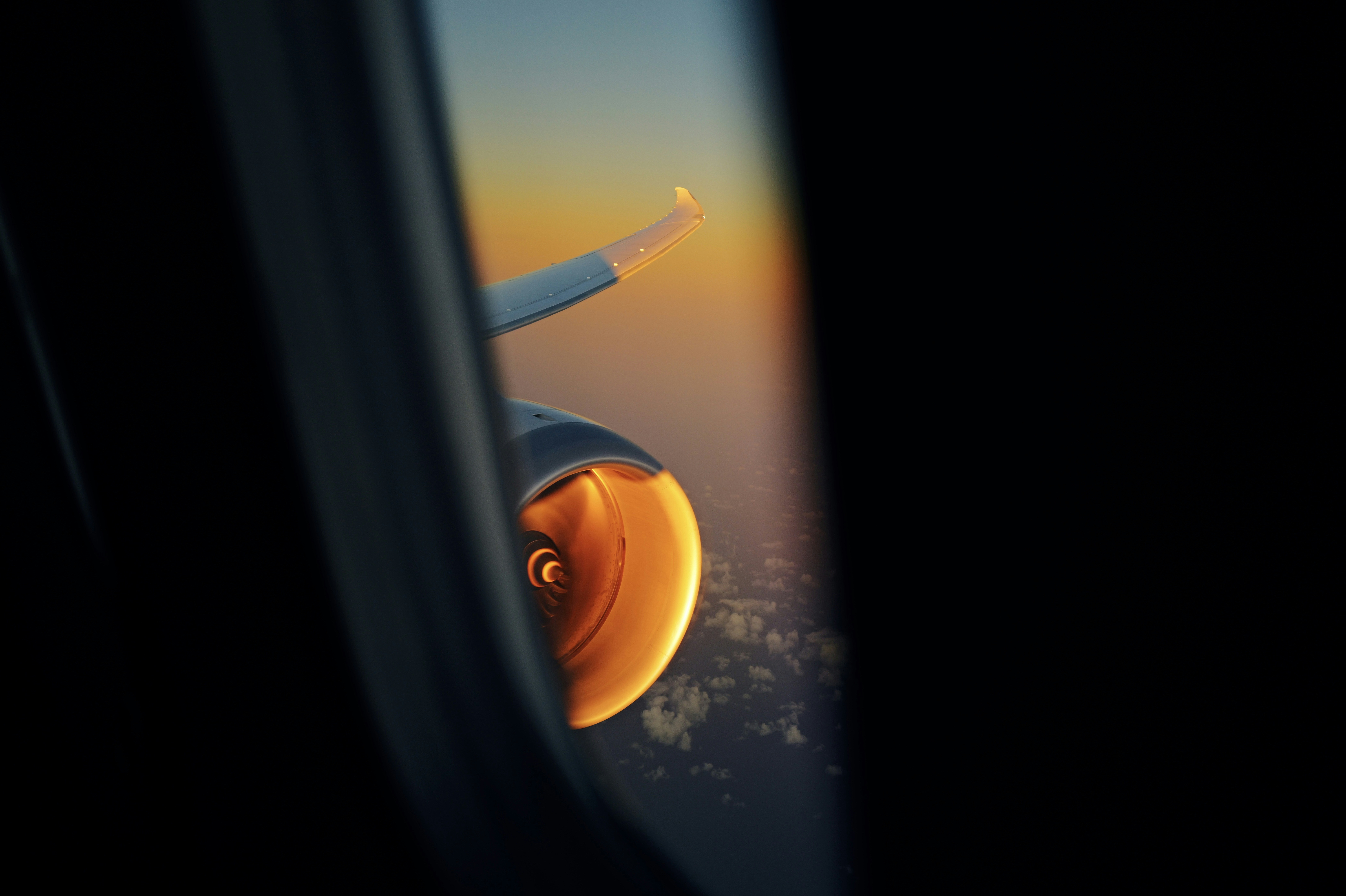 A view of the wing of an airplane through a window