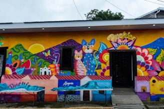 A colorful building with a lot of paintings on it