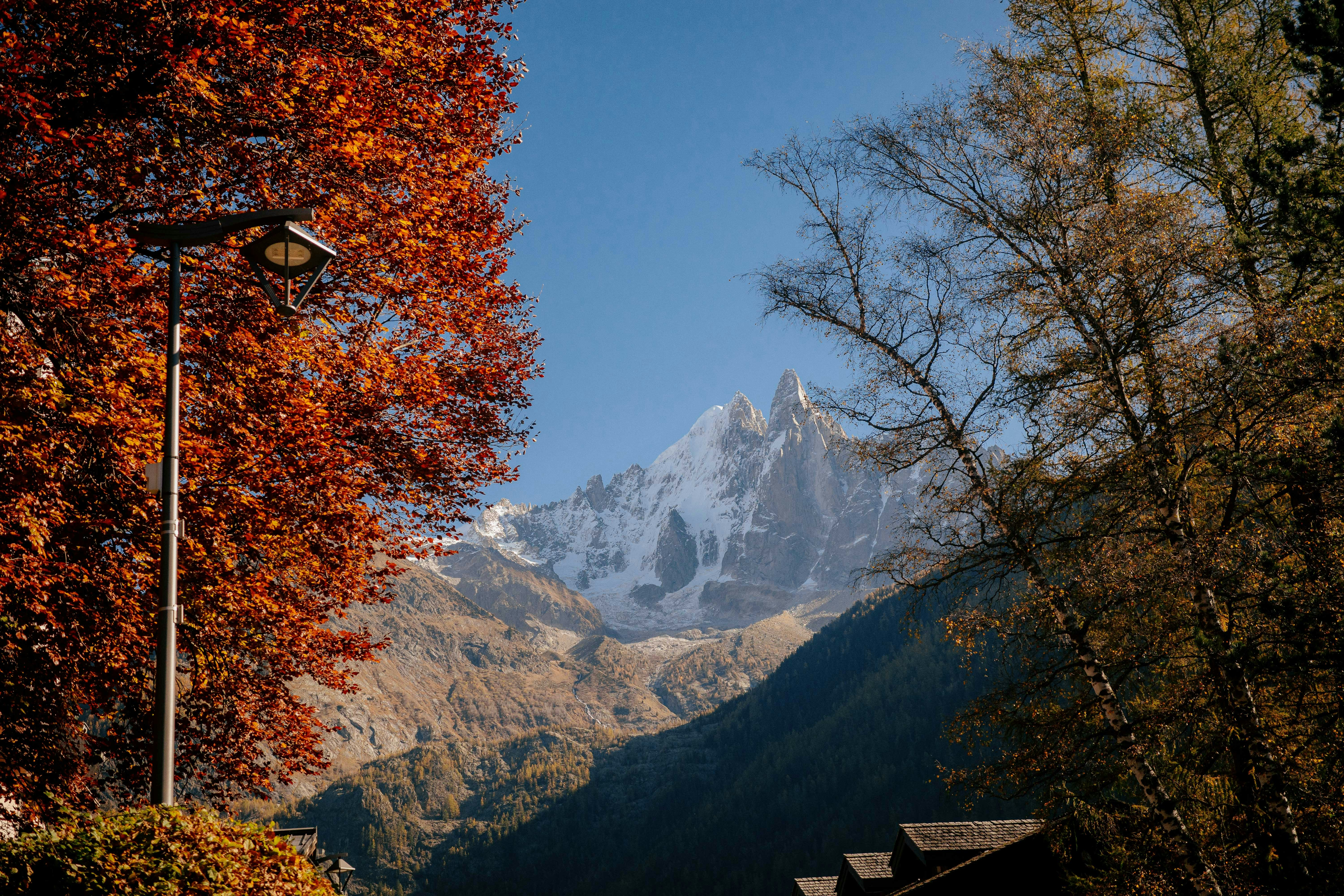 A street light in front of a mountain range