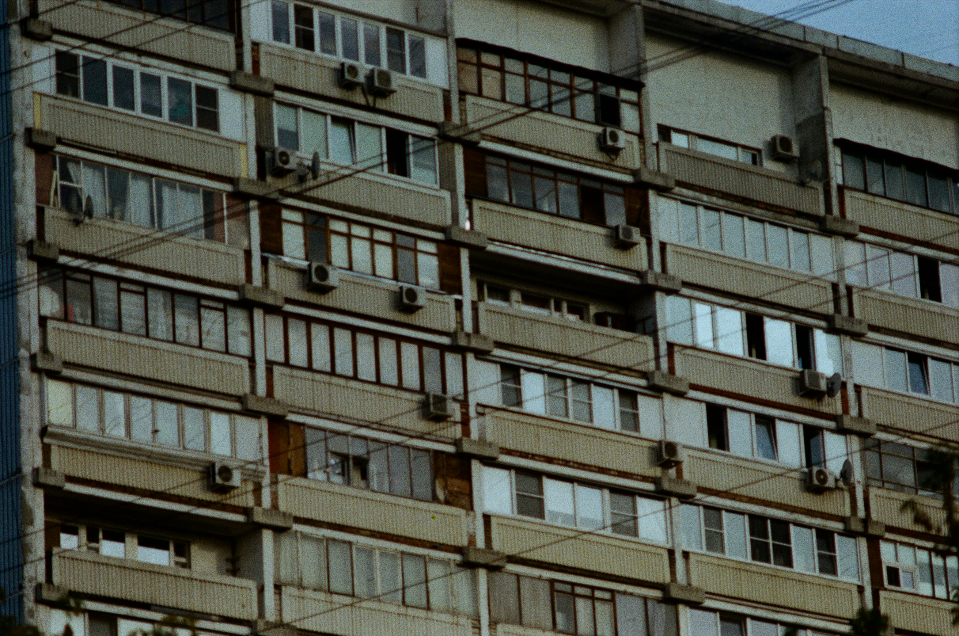 Tall building with lots of windows and balconies