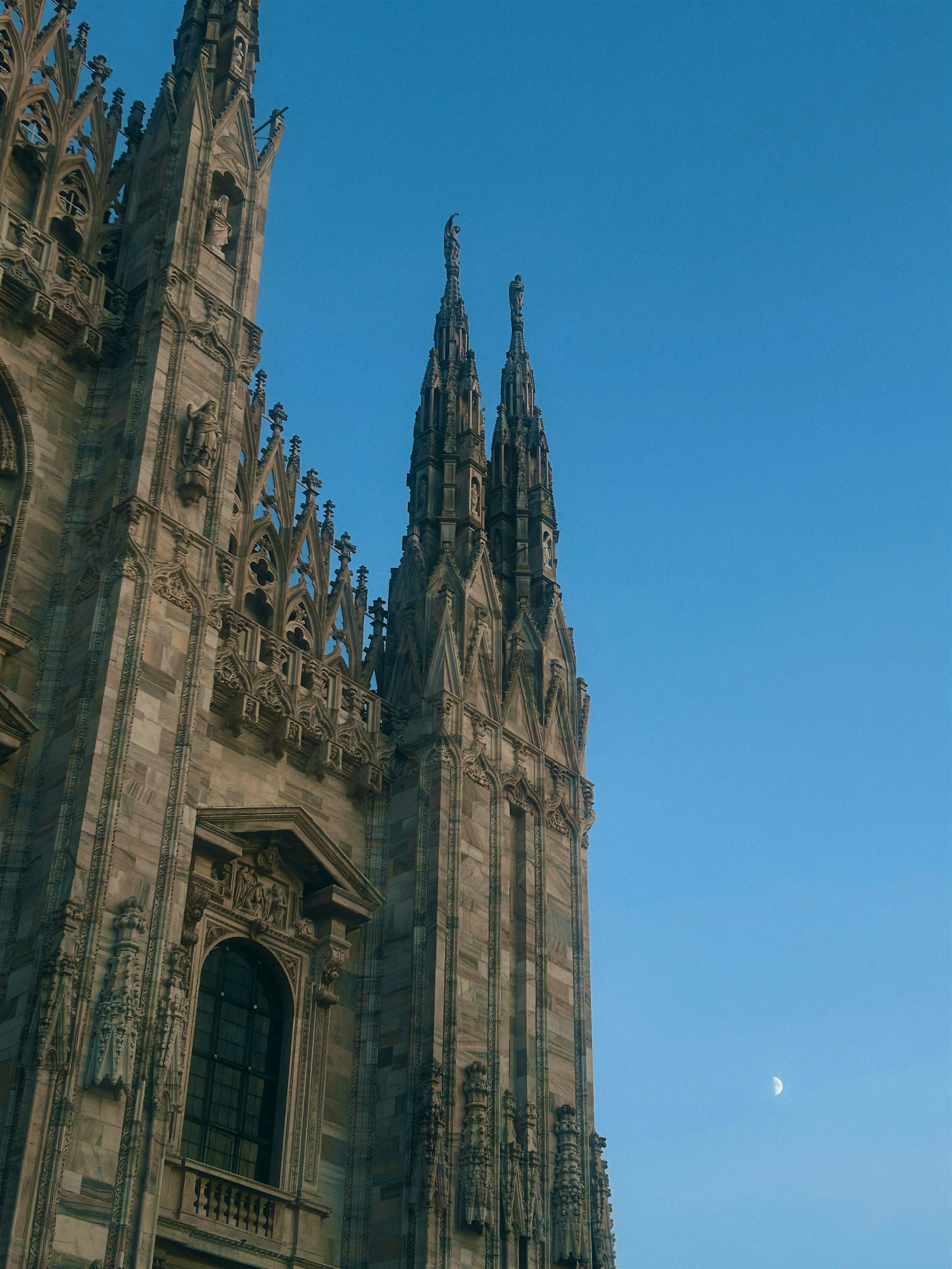 A very tall building with a clock on it's side
