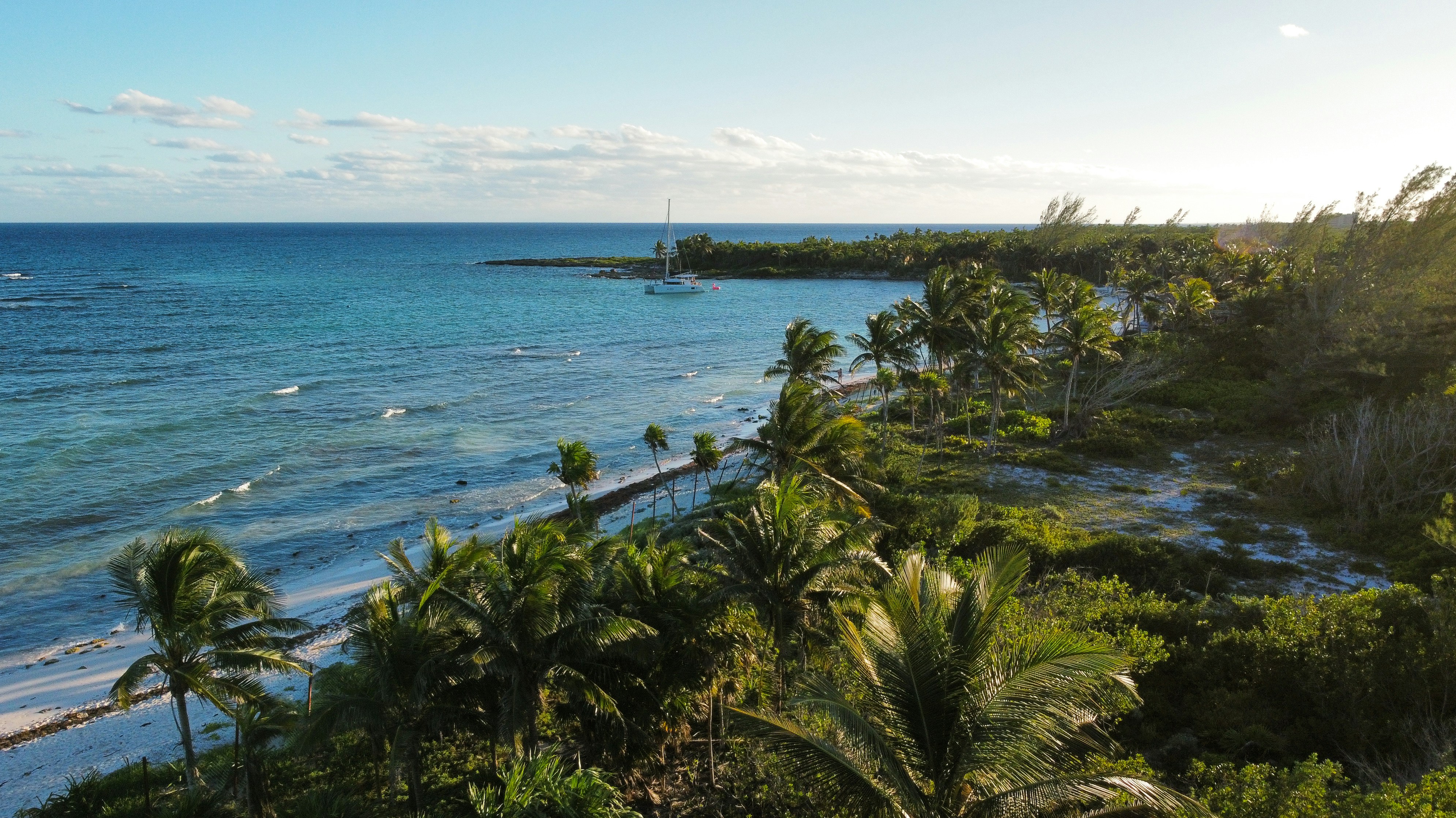 A view of the ocean from a hill overlooking the beach, 