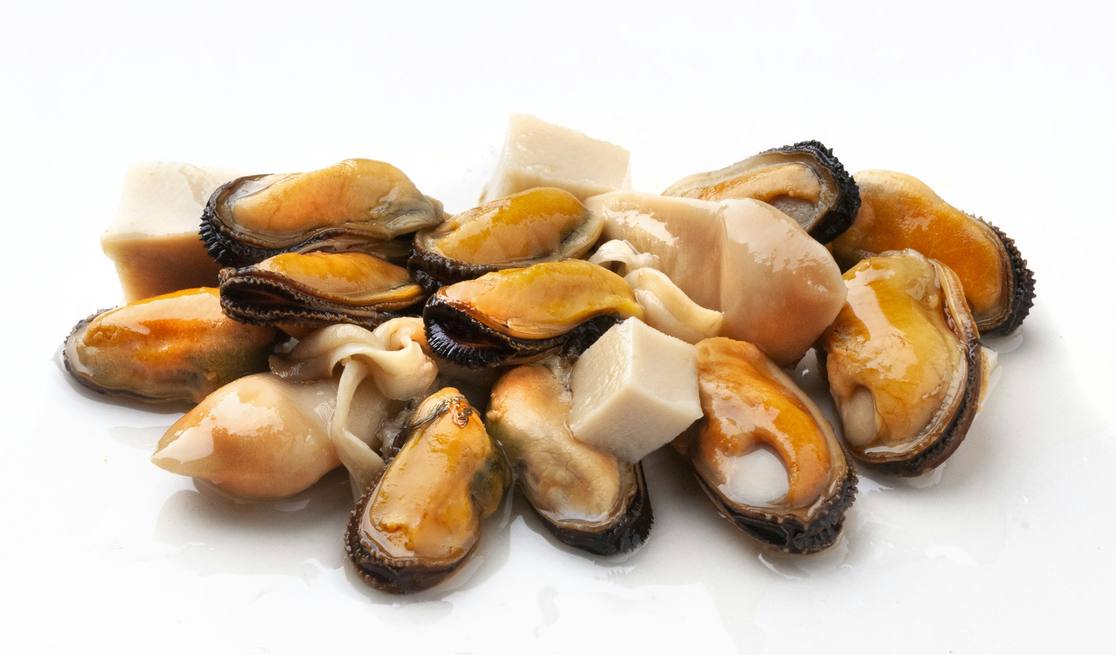 A pile of shellfish sitting on top of a white table