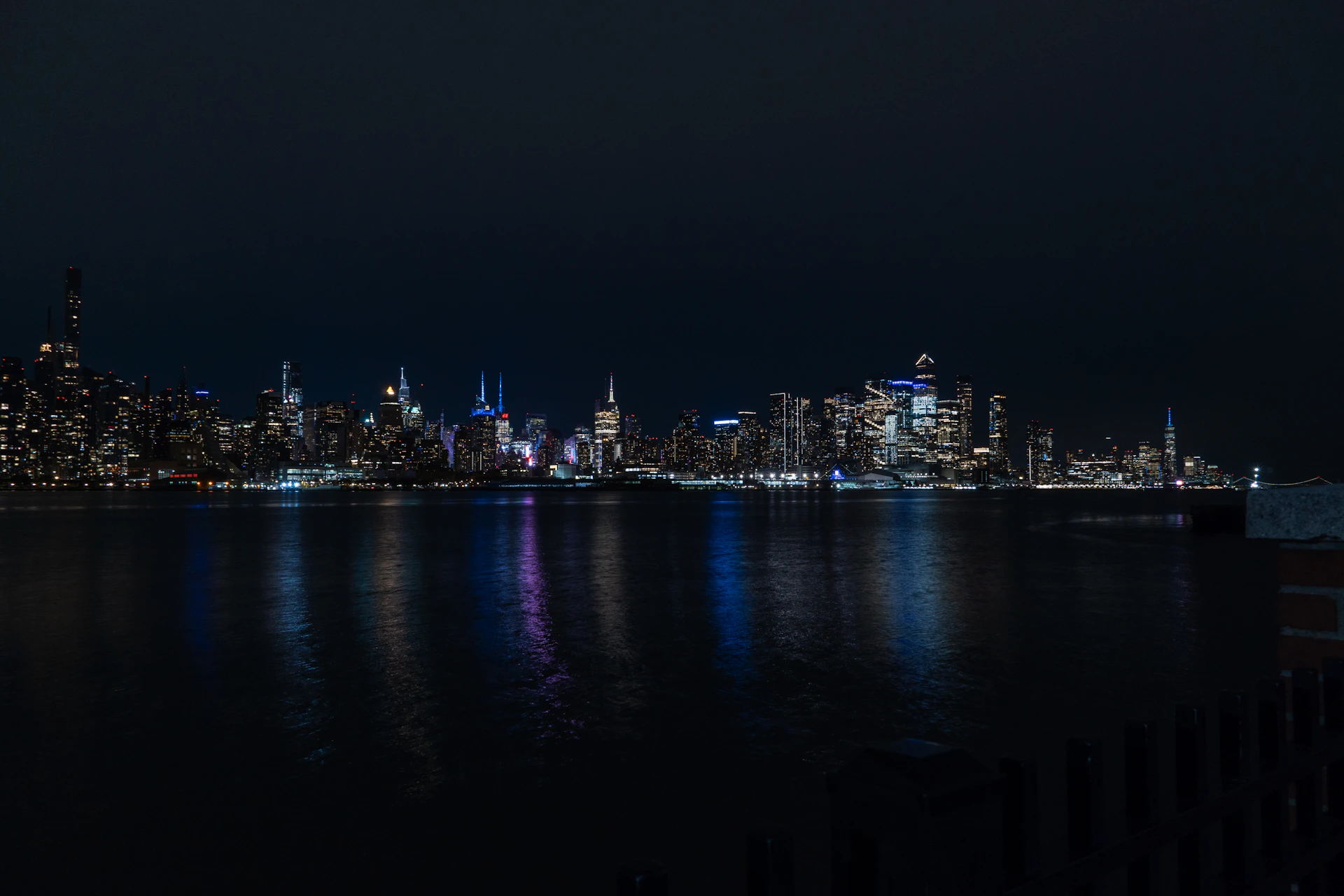 A view of a city at night from across the water