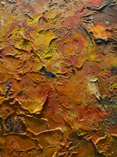 An abstract painting of orange and yellow colors