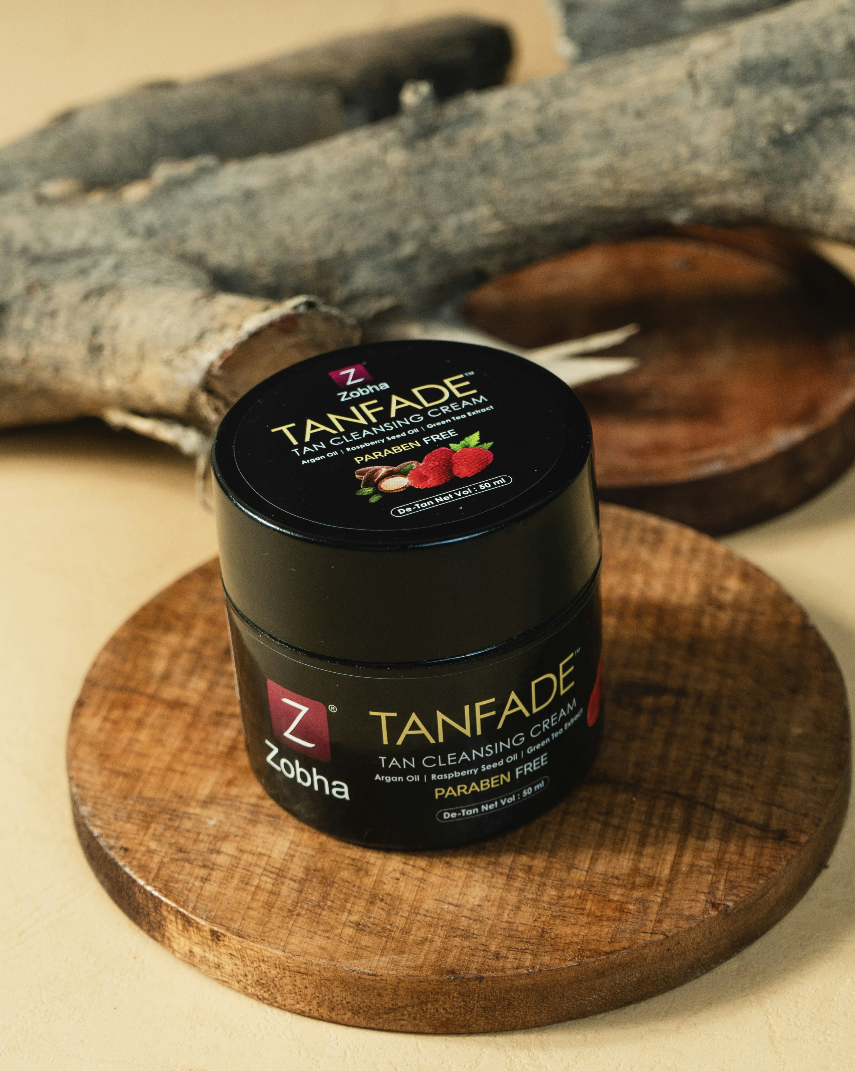 A jar of tanfade sitting on a wooden plate