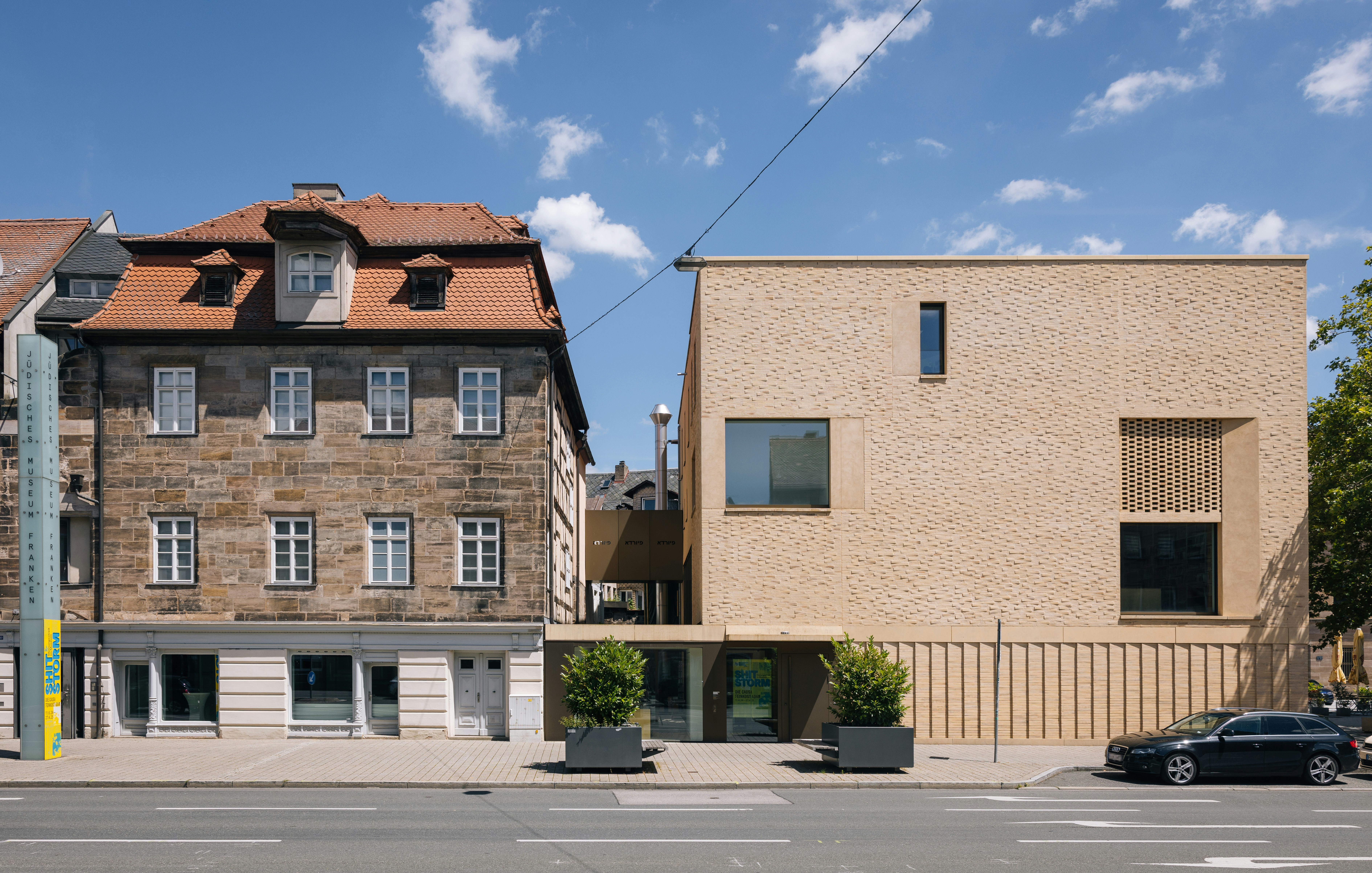 A row of buildings sitting on the side of a road