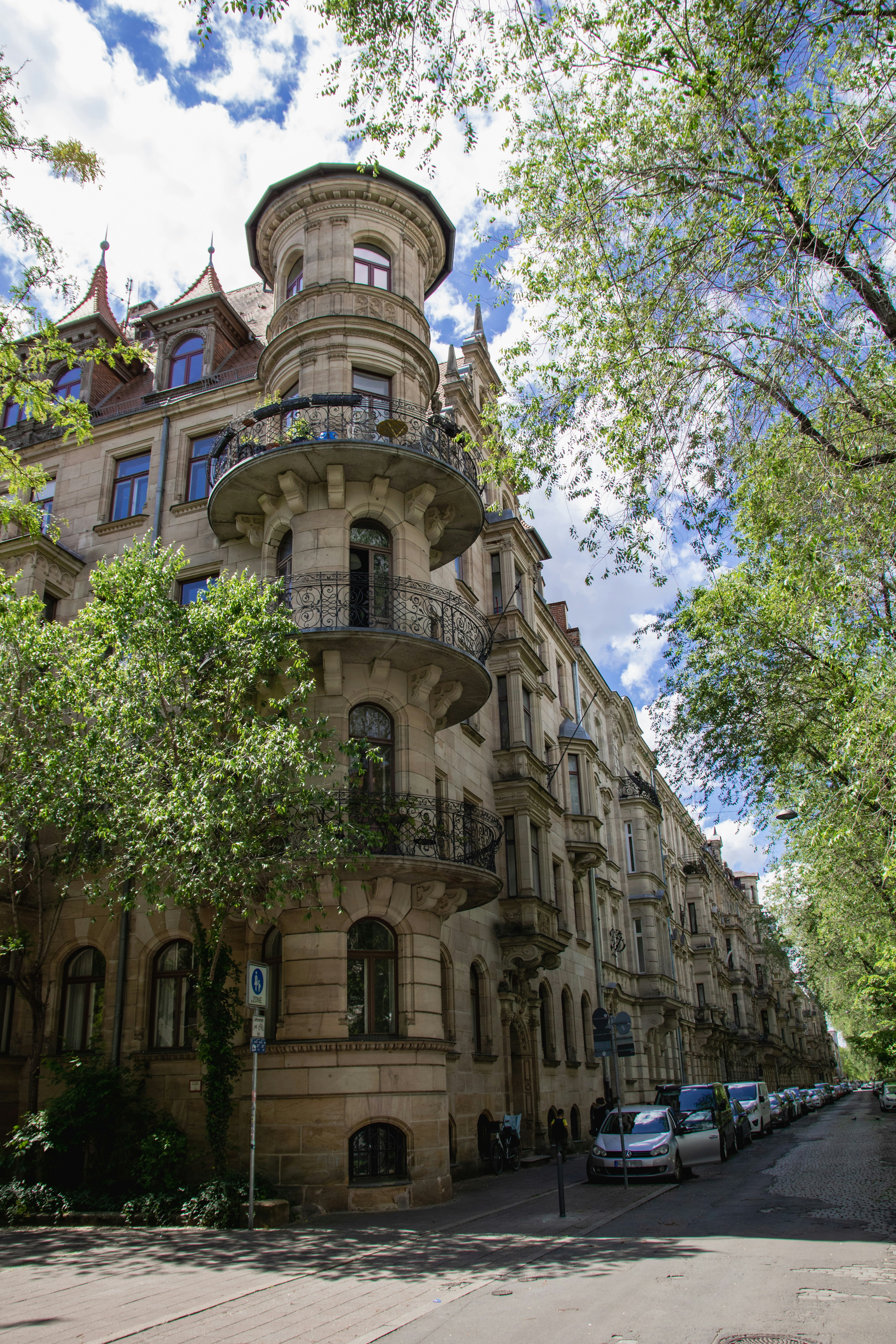 A very tall building sitting on the side of a road