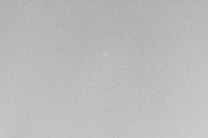 A black and white photo of a plane flying in the sky