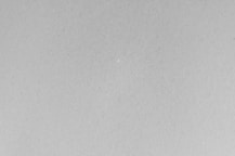 A black and white photo of a plane flying in the sky