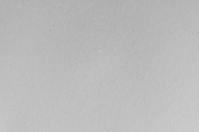 A black and white photo of a plane flying in the sky