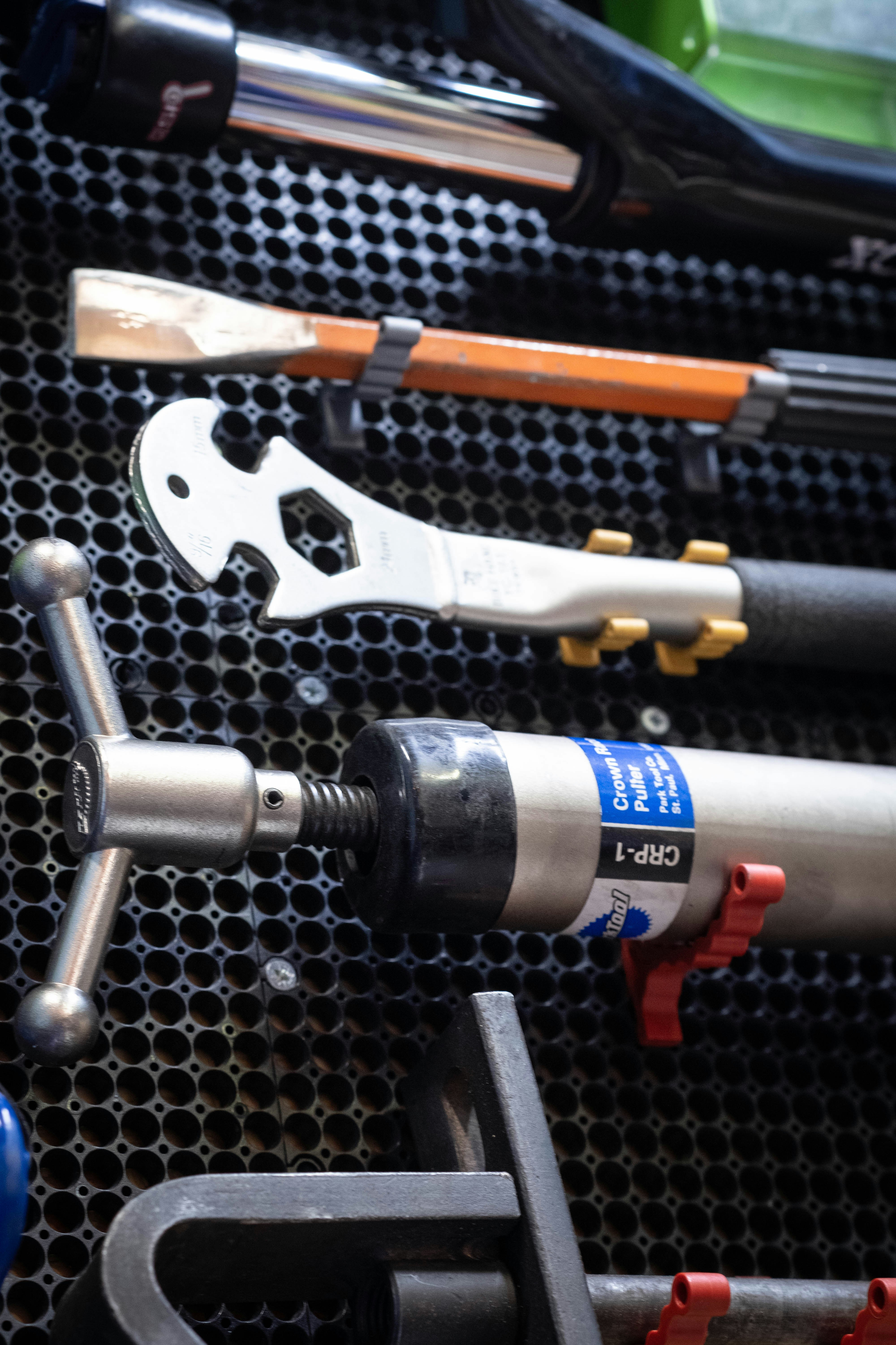 A close up of a bunch of tools on a rack