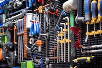 A bunch of pipes are lined up on a wall