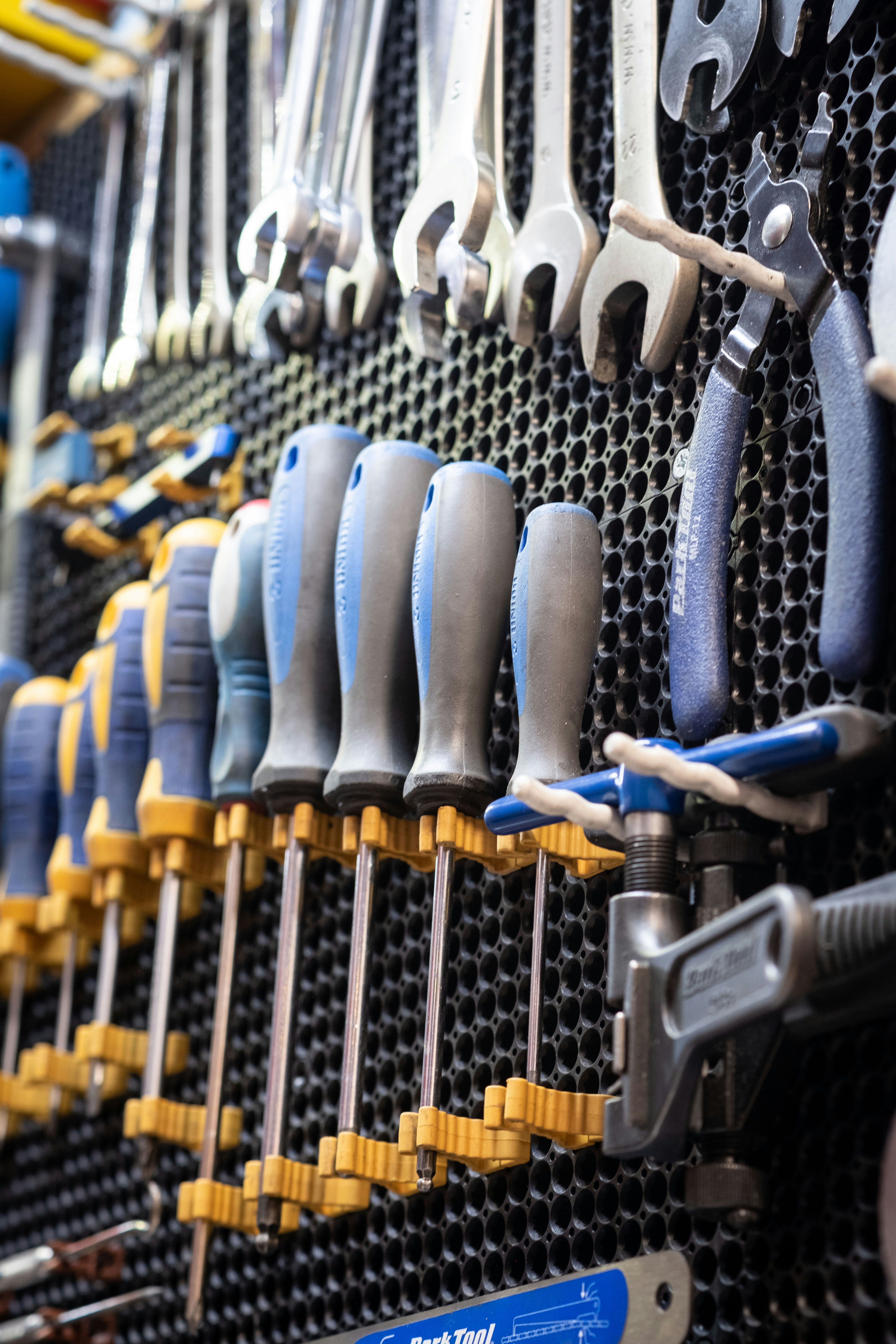 A bunch of tools hanging on a wall