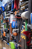 A bunch of tools are hanging on a wall