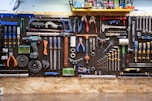 A bunch of tools hanging up on a wall