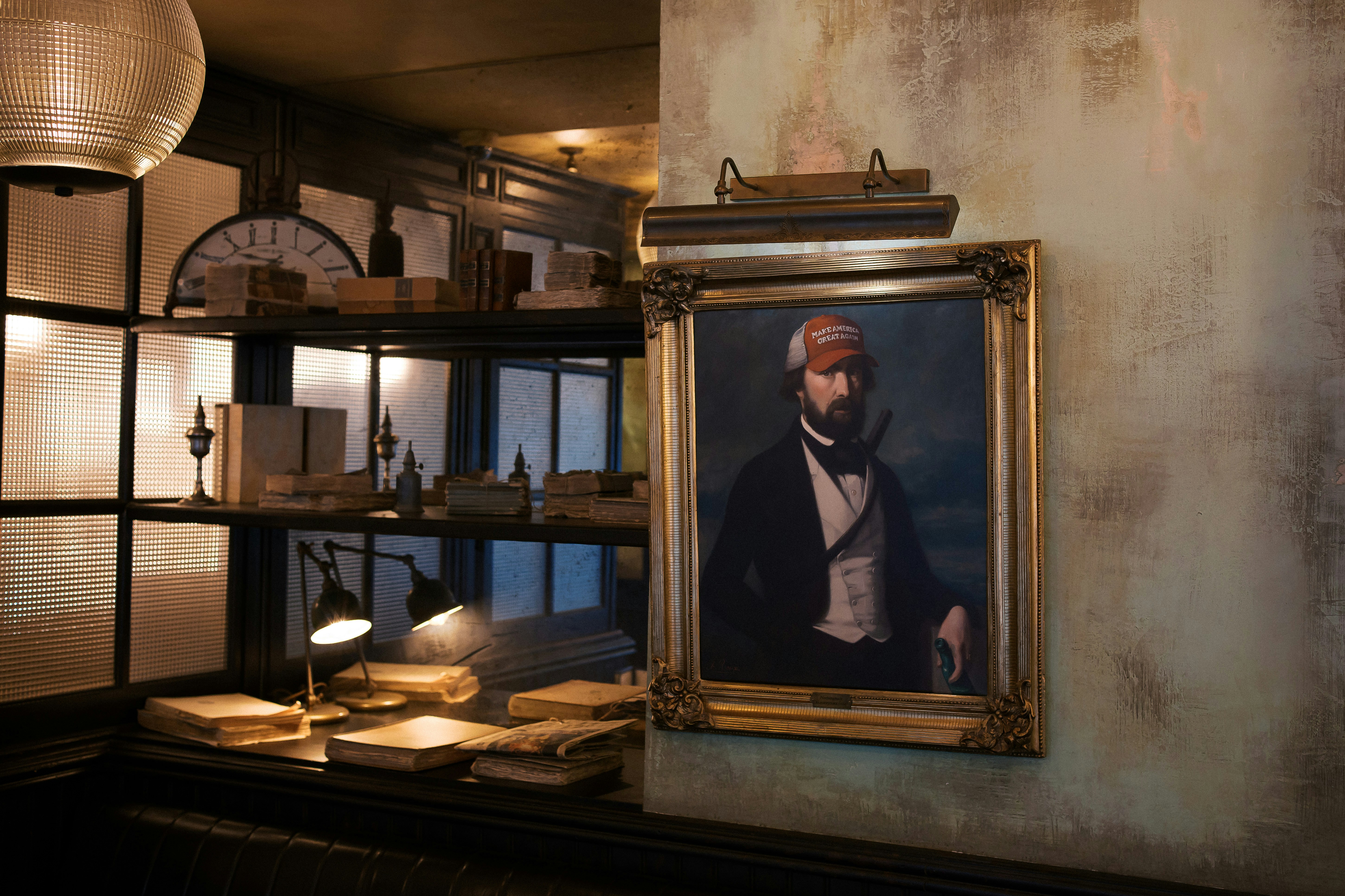 A painting of a man is hanging on the wall