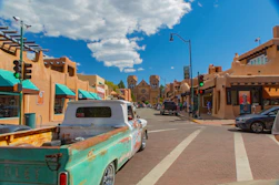 A street with cars parked on the side of it