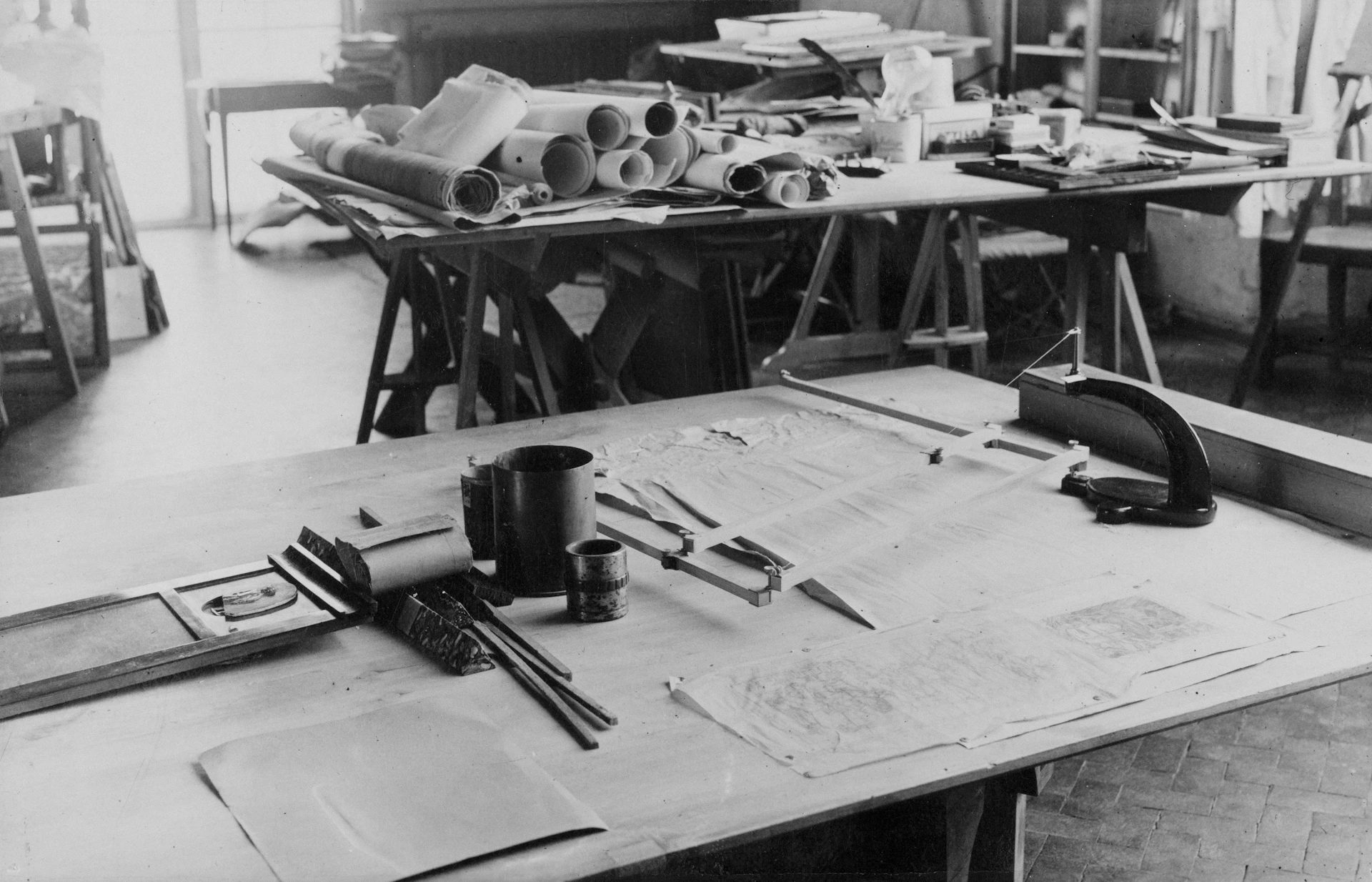 Architectural drafting table with blueprints and tools