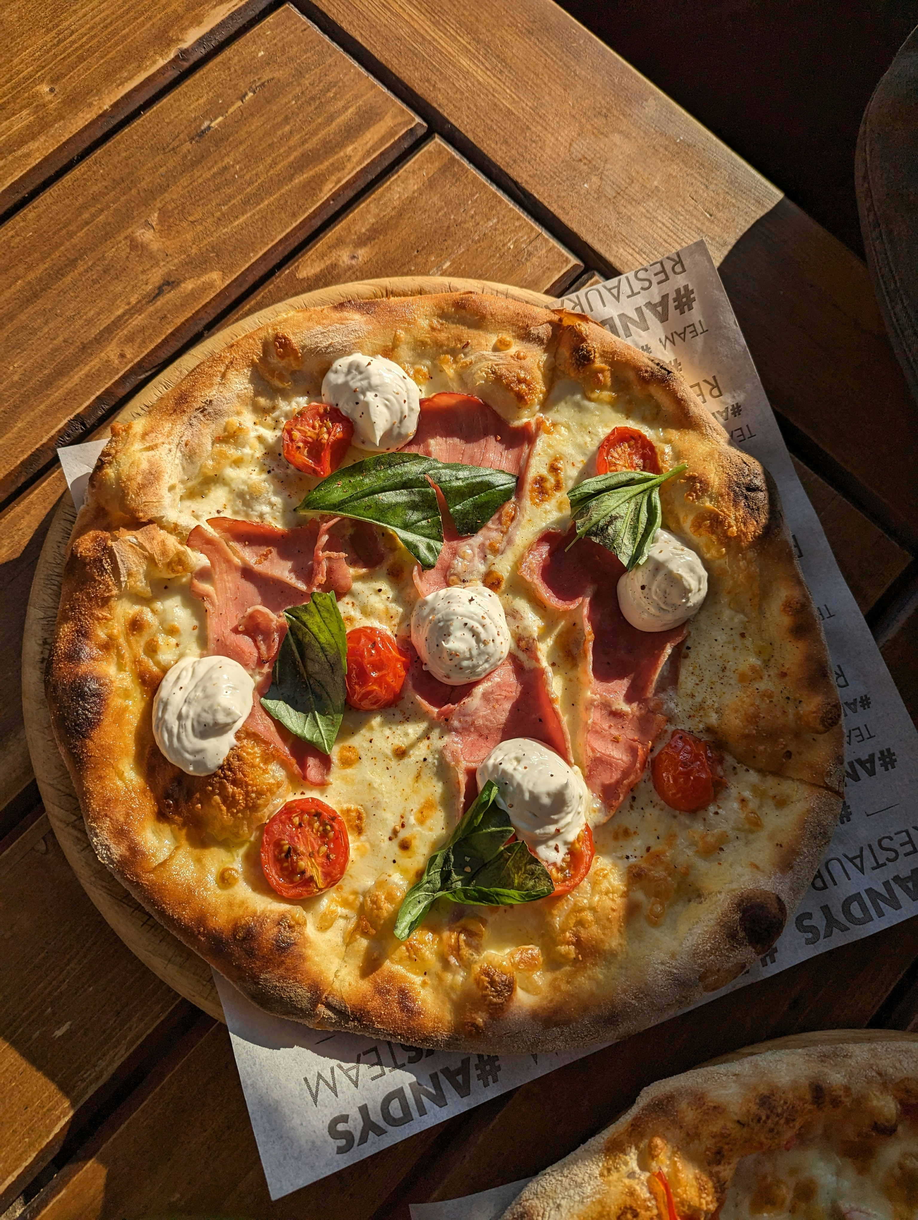 A pizza sitting on top of a wooden table