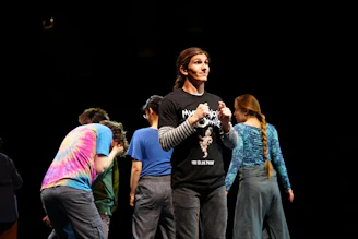 A group of people standing on top of a stage
