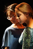 Two young women looking at a cell phone