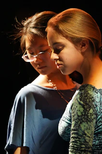 Two young women looking at a cell phone