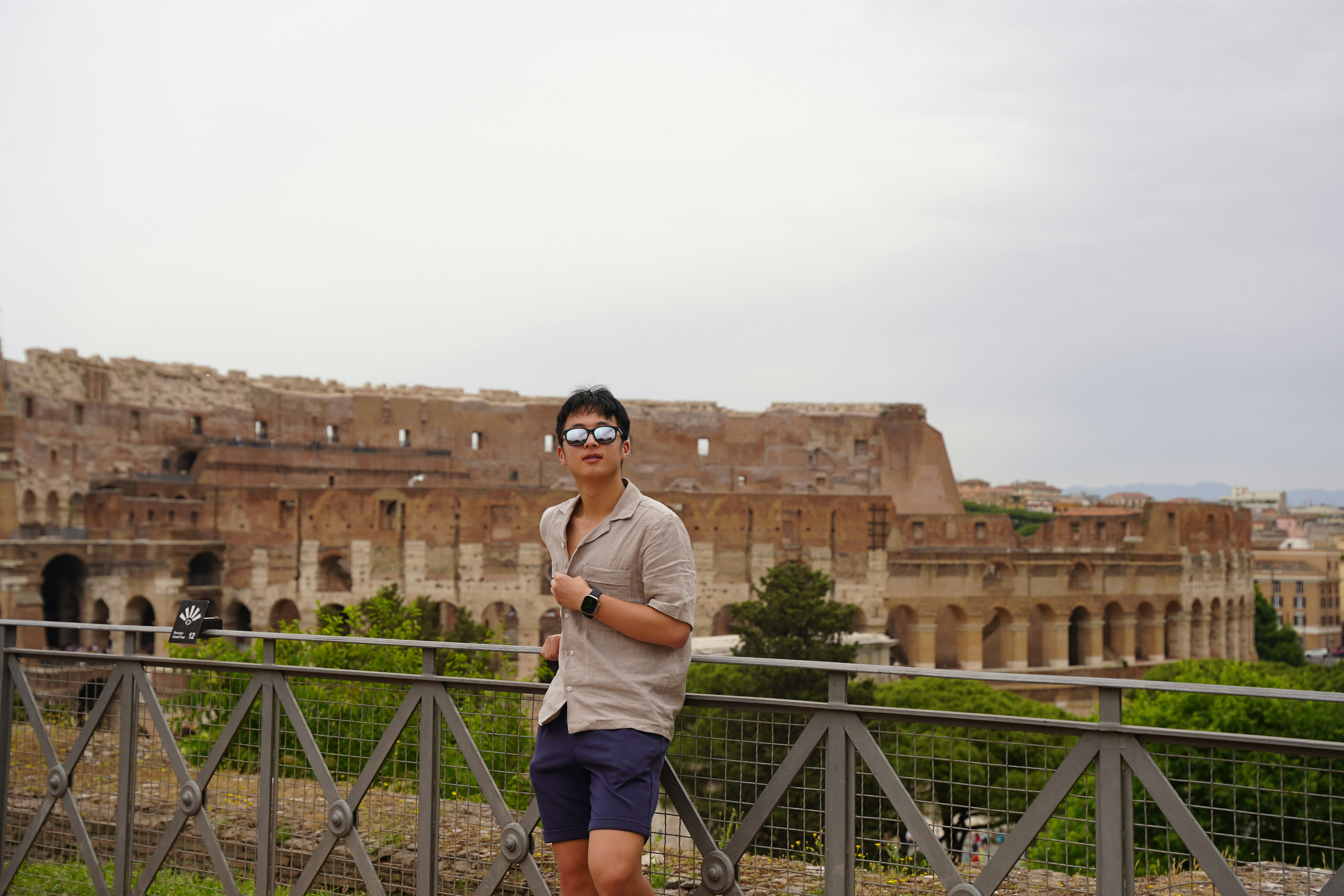 Man on bridge in front of building