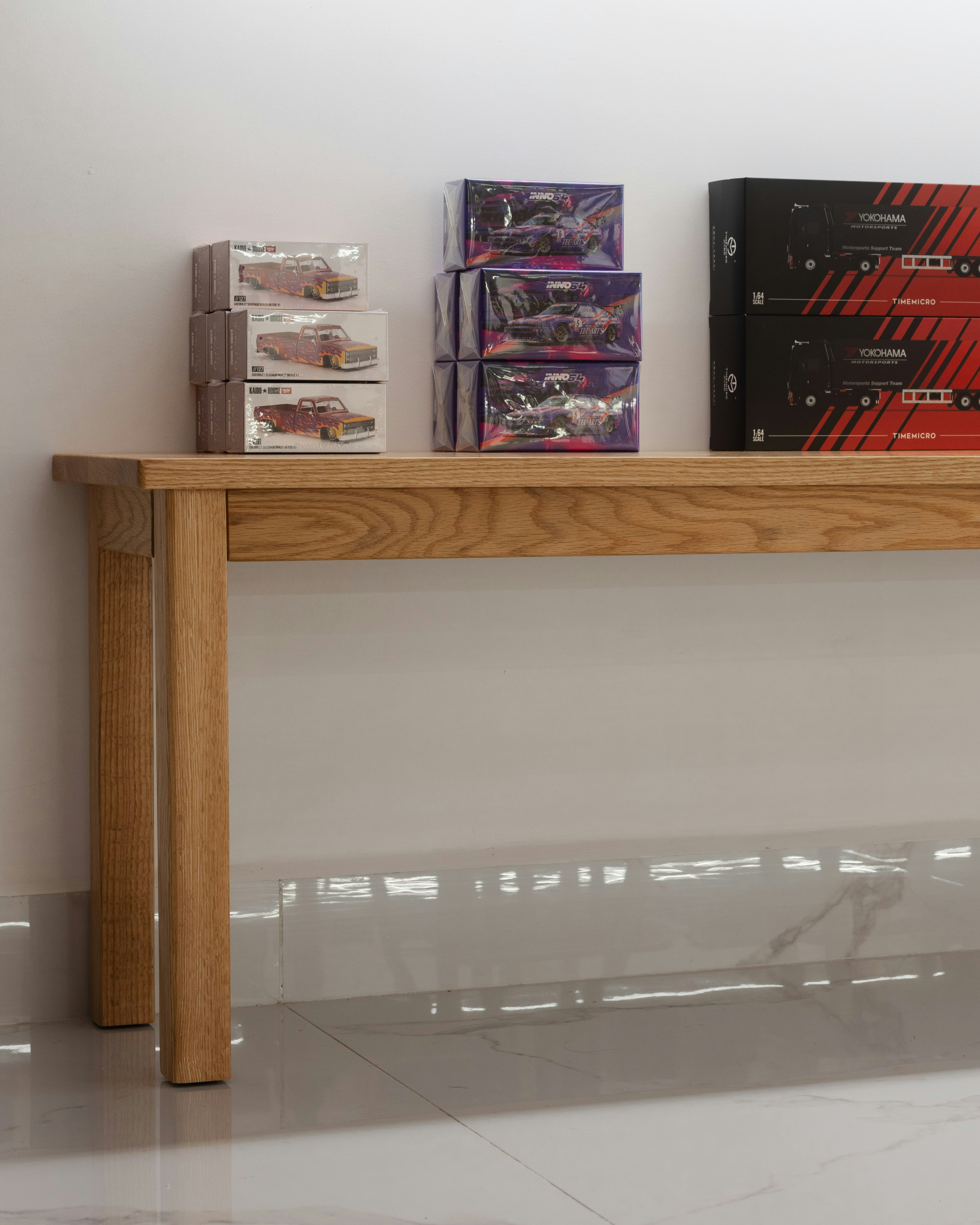 A wooden table topped with boxes of candy photo – Free Wallpaper Image ...