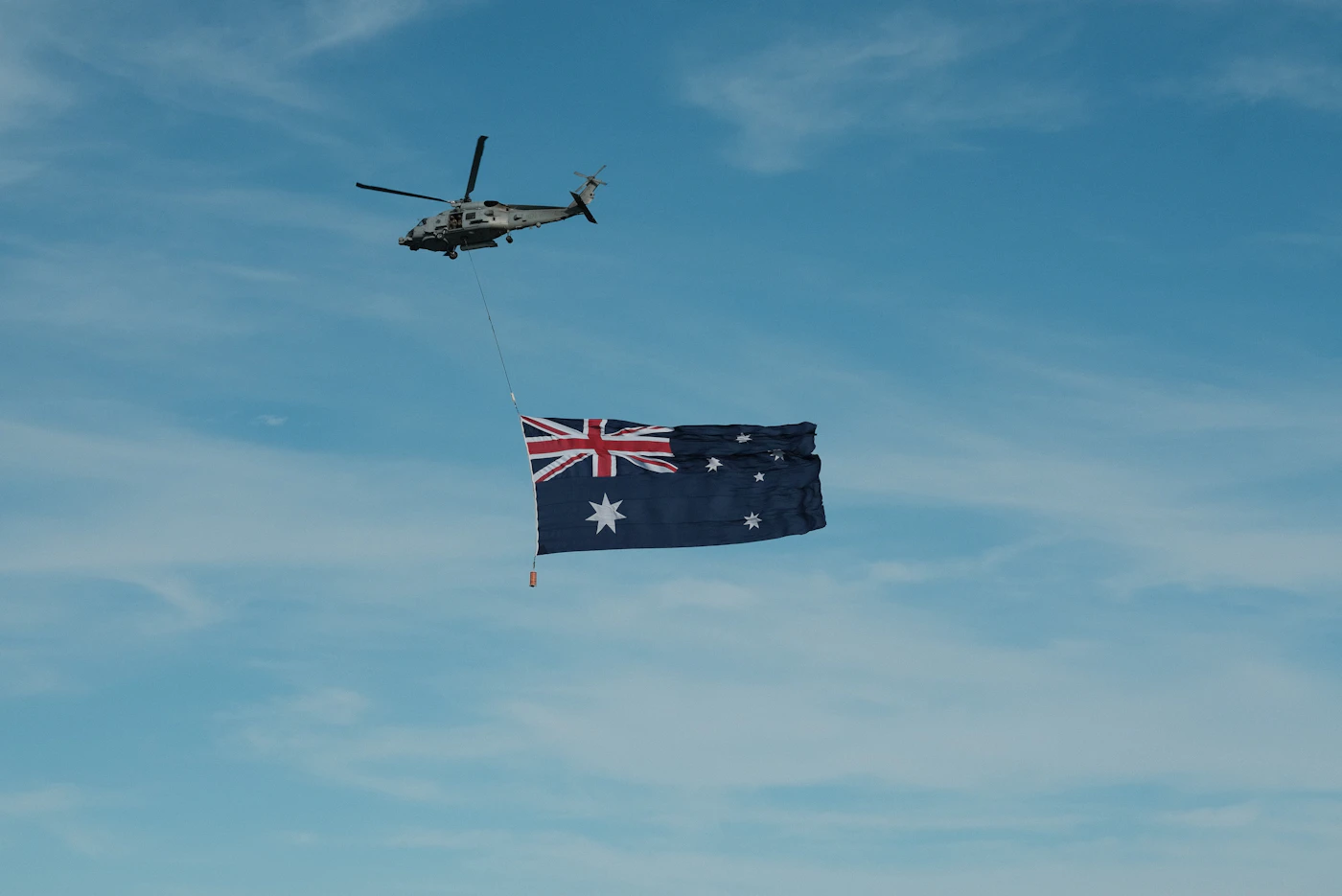 ADF helicopter flying the Australian flag