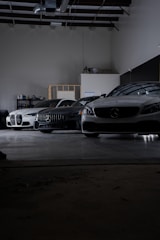 A group of cars parked in a garage