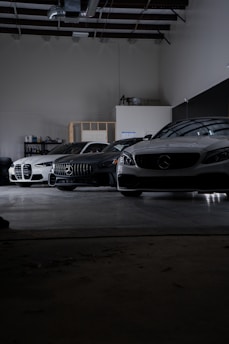A group of cars parked in a garage