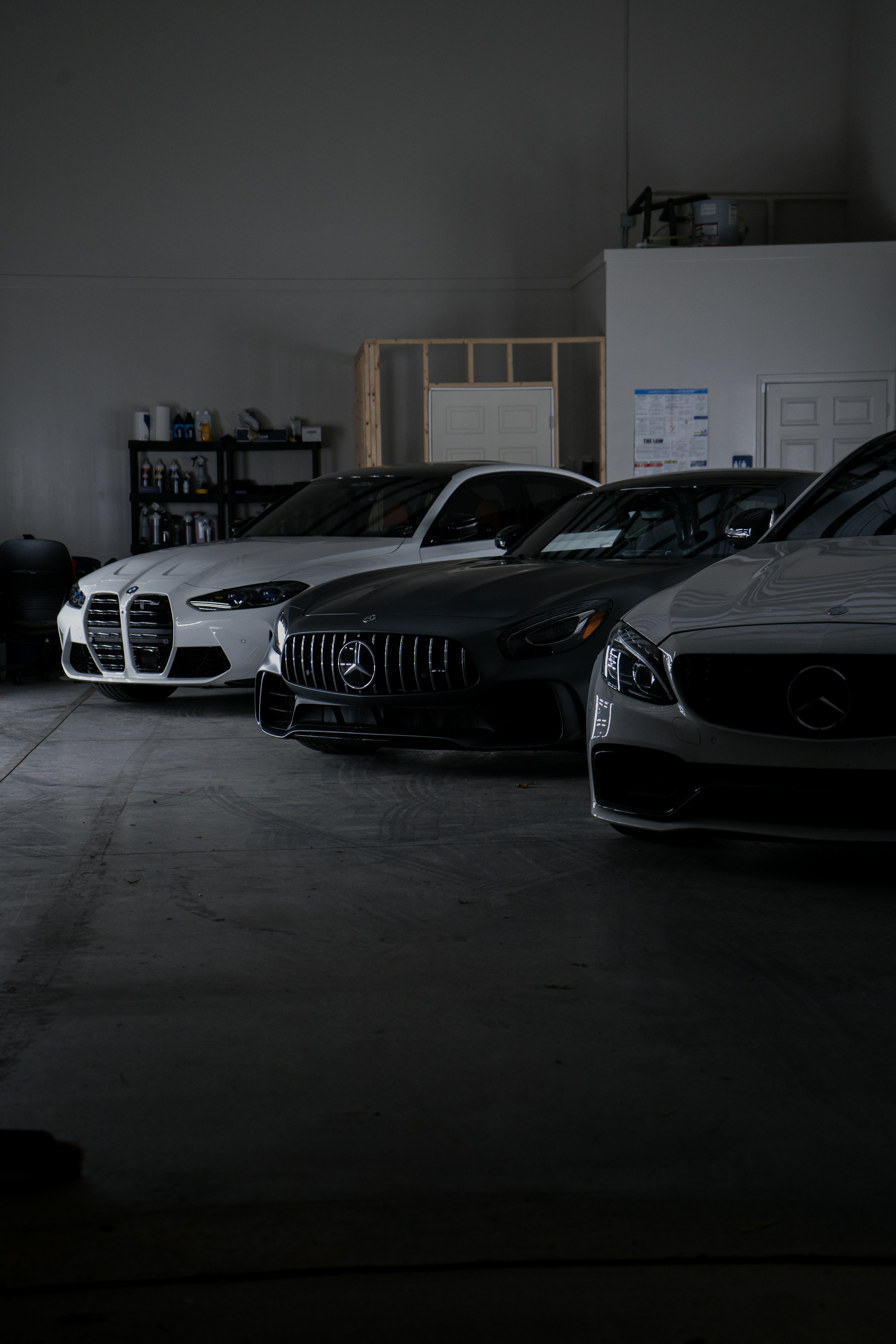 A group of cars parked in a garage
