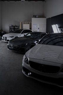 A group of cars parked in a garage