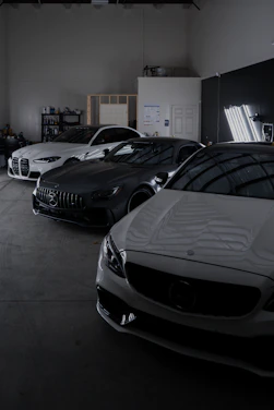 A group of cars parked in a garage