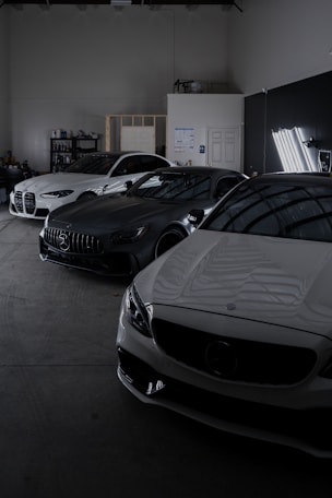 A group of cars parked in a garage