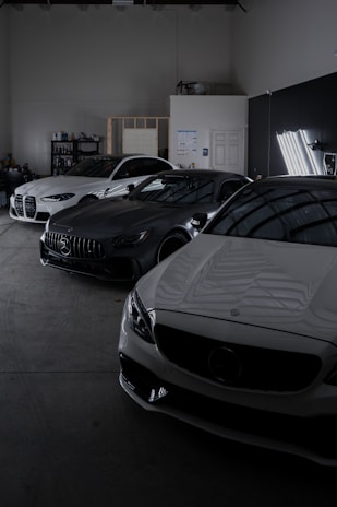 A group of cars parked in a garage