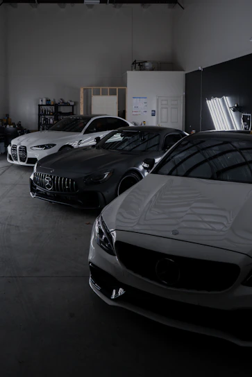 A group of cars parked in a garage