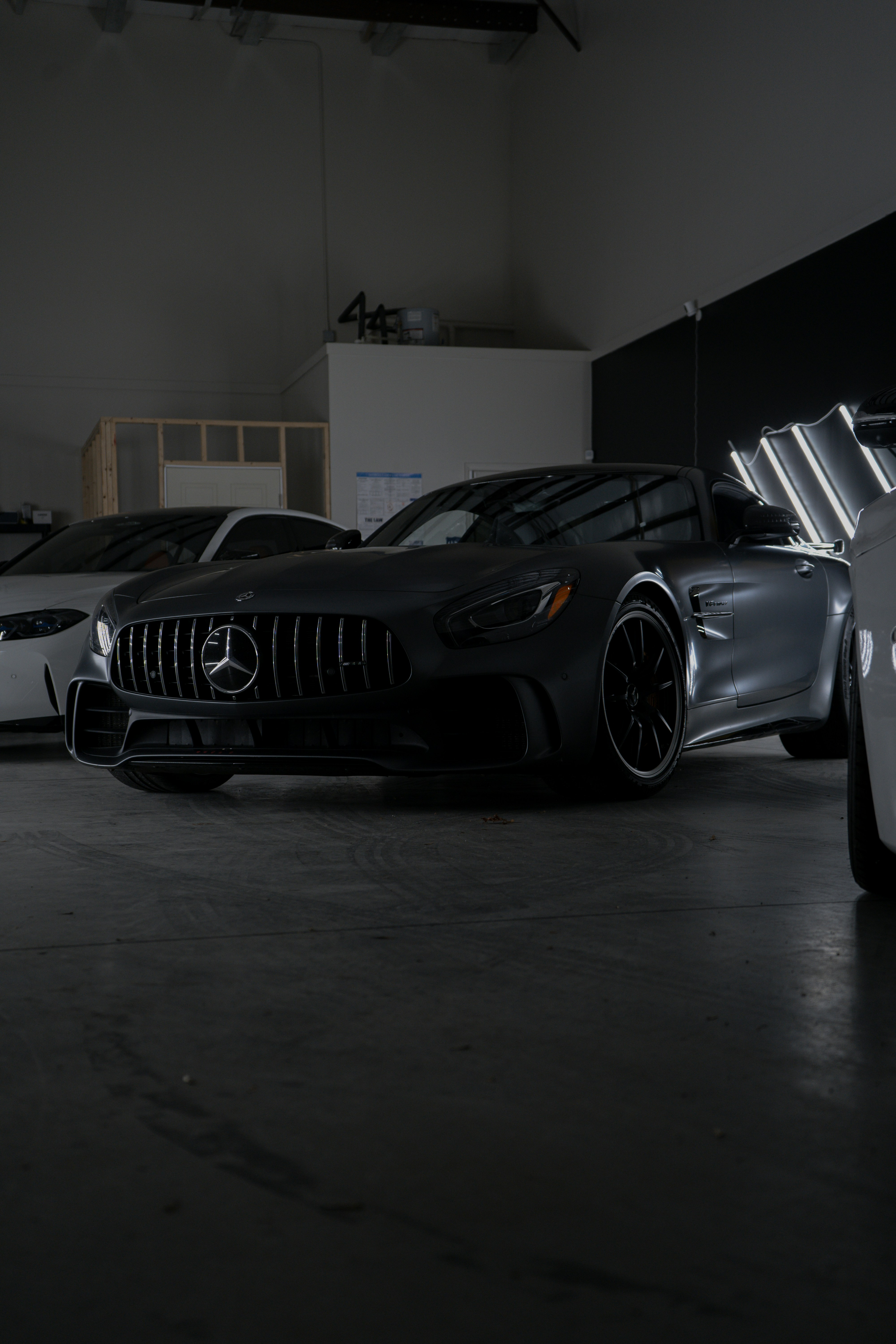 A group of cars parked in a garage