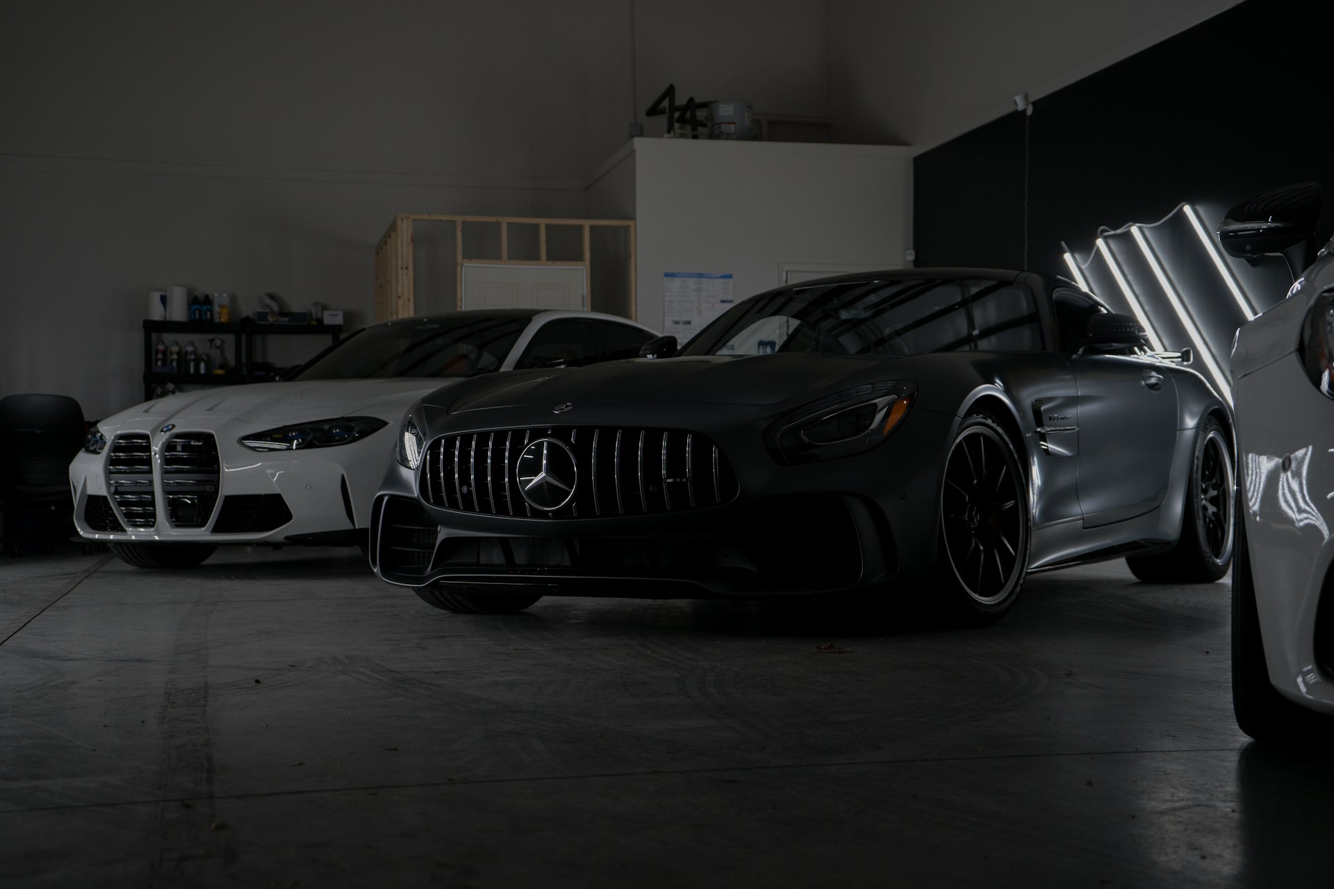 A group of cars parked in a garage