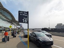 A car parked in front of an airport