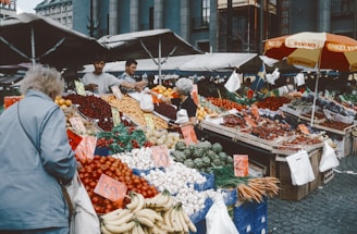 An outdoor market with lots of fruits and vegetables