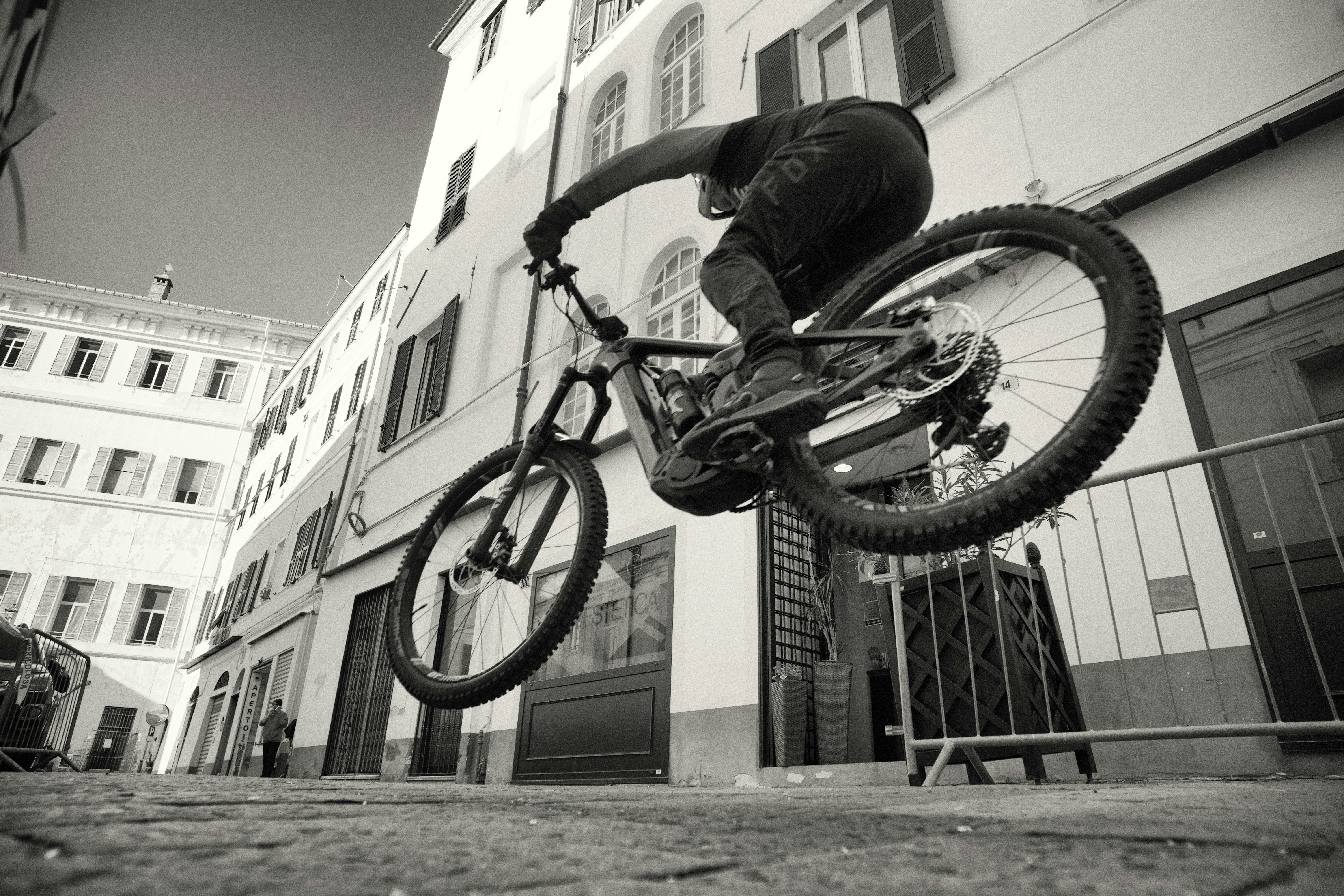 A man riding a bike up the side of a ramp