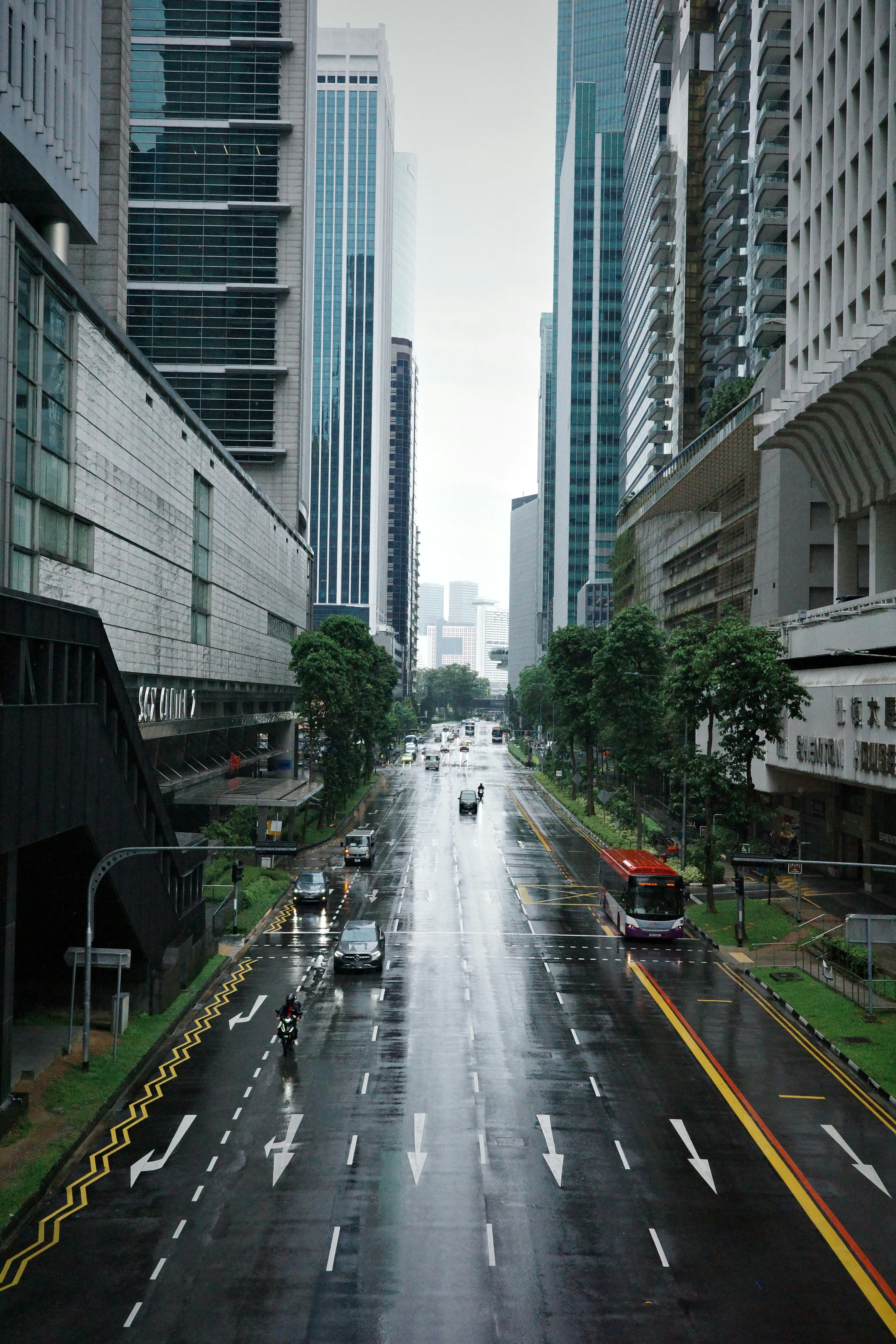 A city street with cars driving down it