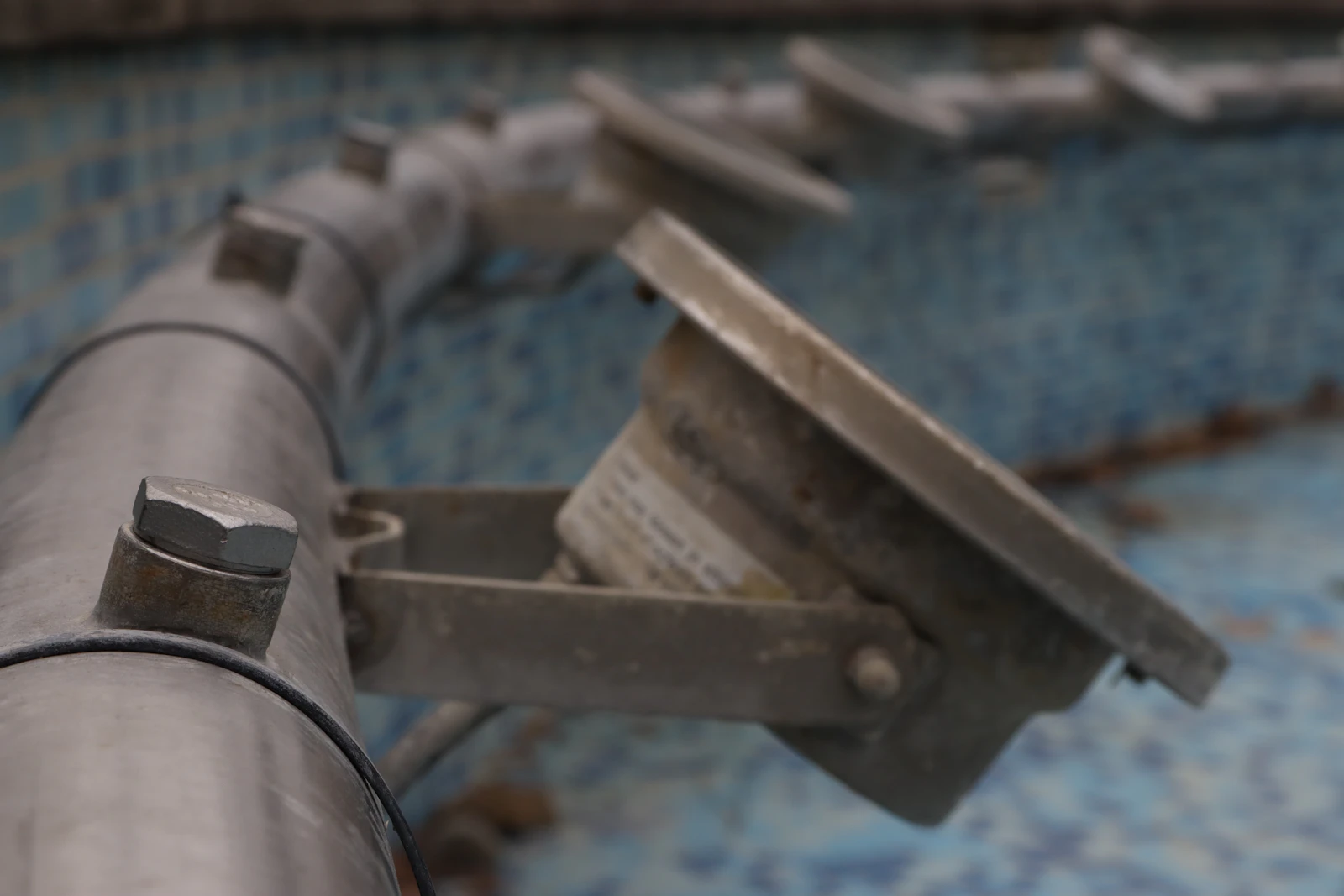 Close-up of pool equipment being serviced