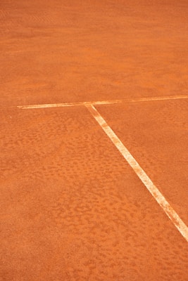 Tennis Court Surfaces Explained: How Clay, Hard, and Grass Change Your Gear Needs