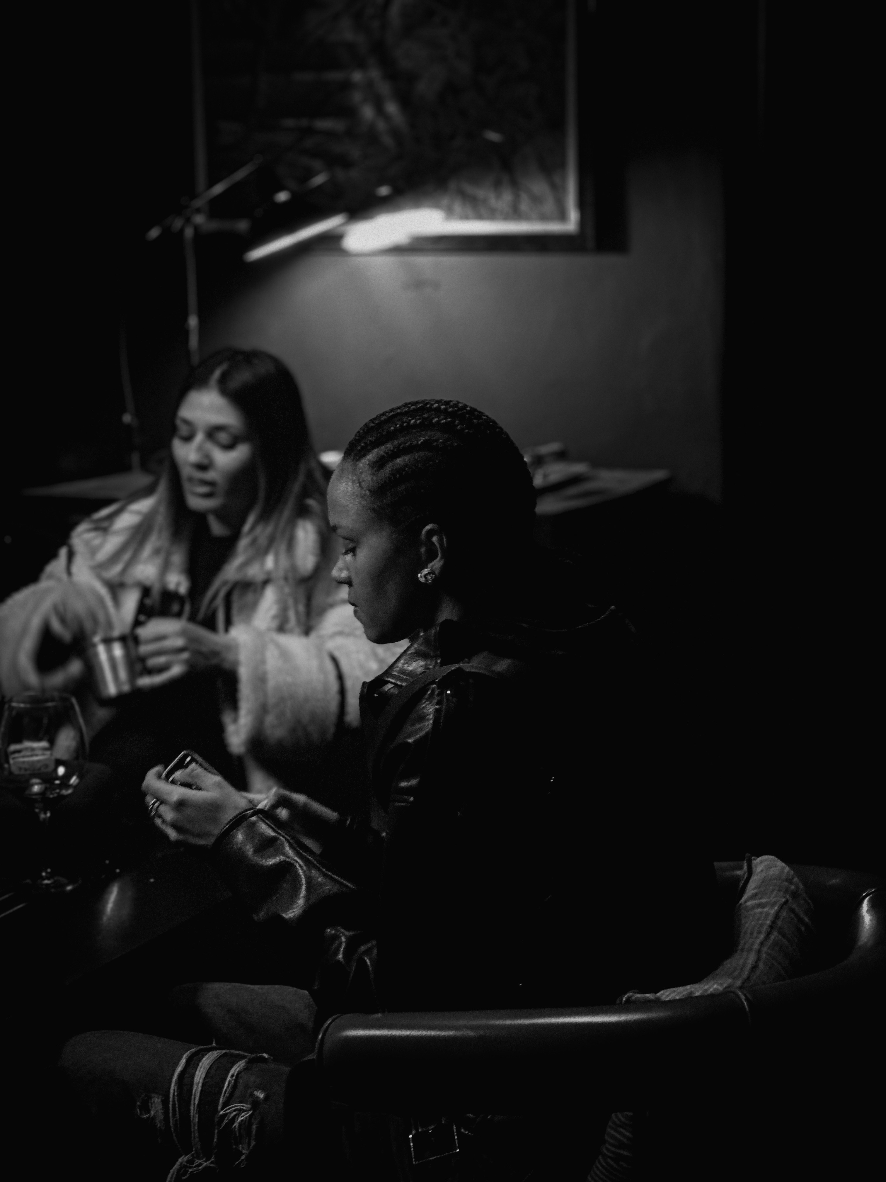 A group of people sitting in a dark room
