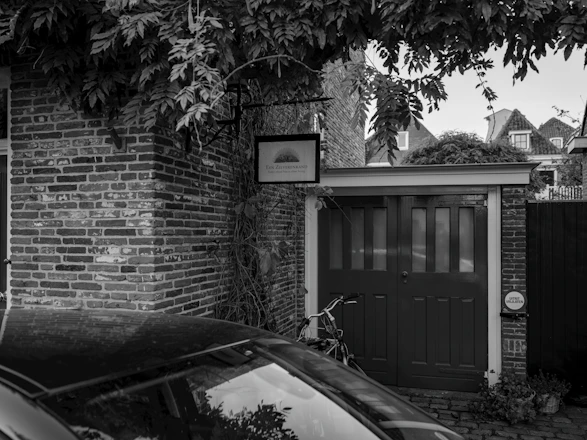 A car parked in front of a brick building