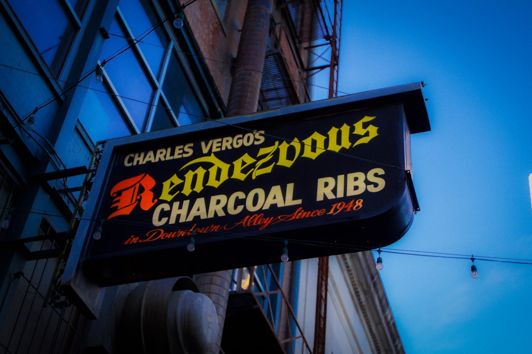 A neon sign for a bar called charocal ribs